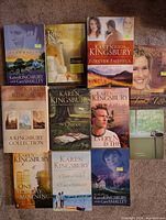 All 11 paperback novels laid out together