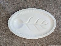 Top view of oval white ceramic turkey platter