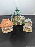 Group view of three miniature village houses