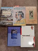 All five books front covers visible