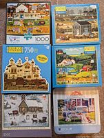 All six puzzle packages laid out