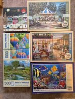 All six boxed puzzles laid out front facing