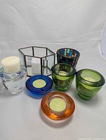 Group shot of all seven glass candle holders