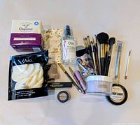 Full lot overview showing all cosmetics, brushes, sponges, powders and soap