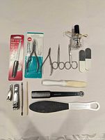 Overview of 15 manicure and pedicure items laid out on surface
