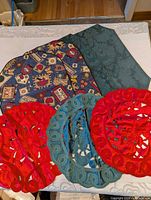 Group shot showing all four placemats and three doilies