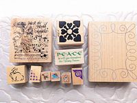 Top view of all ten wood-mounted stamps showing designs