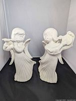 Both angel figurines full view