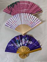 Overview of all three folding fans laid out open