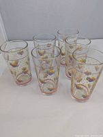 Front view of six tumblers showing pattern and shape