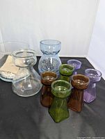 All nine glass vases grouped
