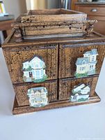 front view showing four drawers with Victorian house pulls