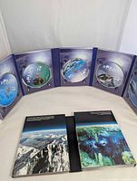 Open collector case showing five The Blue Planet discs and booklets