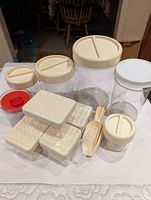 Full set showing canisters, lids, scoops