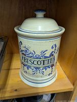 Front view showing hand-painted BISCOTTI banner and floral motif