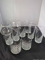 All ten pieces arranged: two brandy snifters, six highballs, two lowballs