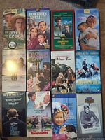 Full view of all 12 VHS tapes laid out in four rows