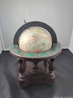 Front view showing globe, zodiac ring, pedestal stand