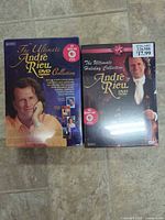 Front view of both sealed André Rieu DVD box sets