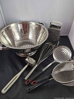 all seven stainless steel utensils grouped