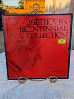 Front of red slipcase box showing title and series information