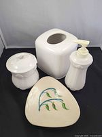 All four ceramic pieces grouped together