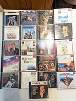 Full layout of 20 CDs plus one additional at bottom showing assorted titles and artwork