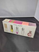 Front of sealed Estée Lauder 5-piece mini fragrance box displaying bottle images