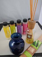 Group shot of all diffuser refills, bottles, reeds and ZipPette