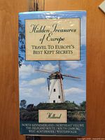 Front view of sealed VHS box showing title, windmill image, Holland subtitle