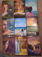 Nine Karen Kingsbury paperback books arranged 3x3 grid