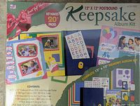 Front of boxed Keepsake Album Kit showing contents graphics