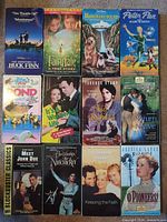 All 12 VHS tapes arranged in three columns