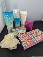Group shot of all bath products and pouf