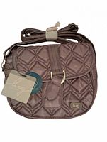 Front view showing quilted design, flap, logo plaque, hang tags, adjustable strap