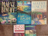 Front covers of all five Maeve Binchy books arranged on surface