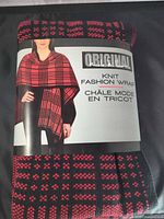 Front of packaged Nicole Miller red & black plaid knit fashion wrap