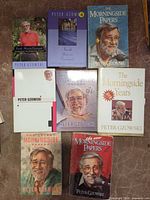 Seven books laid out showing all front covers