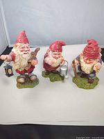 All three gnome figurines on neutral background