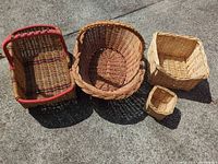 Four baskets grouped: oval, rectangular with red accents, medium square, small square