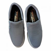 Top view showing both shoes, mesh uppers, size and brand on insoles