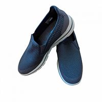 Top angled view showing both shoes, knit uppers and outsole