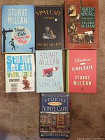 All seven Stuart McLean books laid out front covers visible