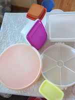 Assorted containers, lids and tray laid out