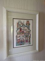 Full view of framed needlepoint picture on wall