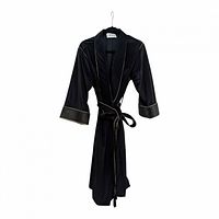 Front view of black velour robe on hanger, showing shawl collar, belt, gold piping