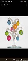 Glass tree with all eight ornaments displayed