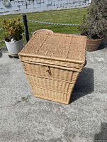 Closed wicker laundry basket showing overall shape and lid