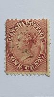 front view showing design, denomination, perforations, cancellation