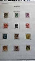 Album page showing 11 Queen Victoria Numeral stamps